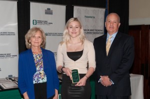 Erika Roberts (center) receives her award from FMFCU Partners in Education Foundation Board Member Dr. Lois Snyder and FMFCU EVP/CFO Mike Magnavita